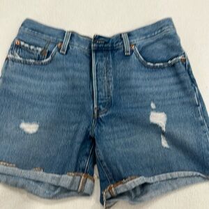 Medium wash Levi 501 denim cutoff shorts size 28